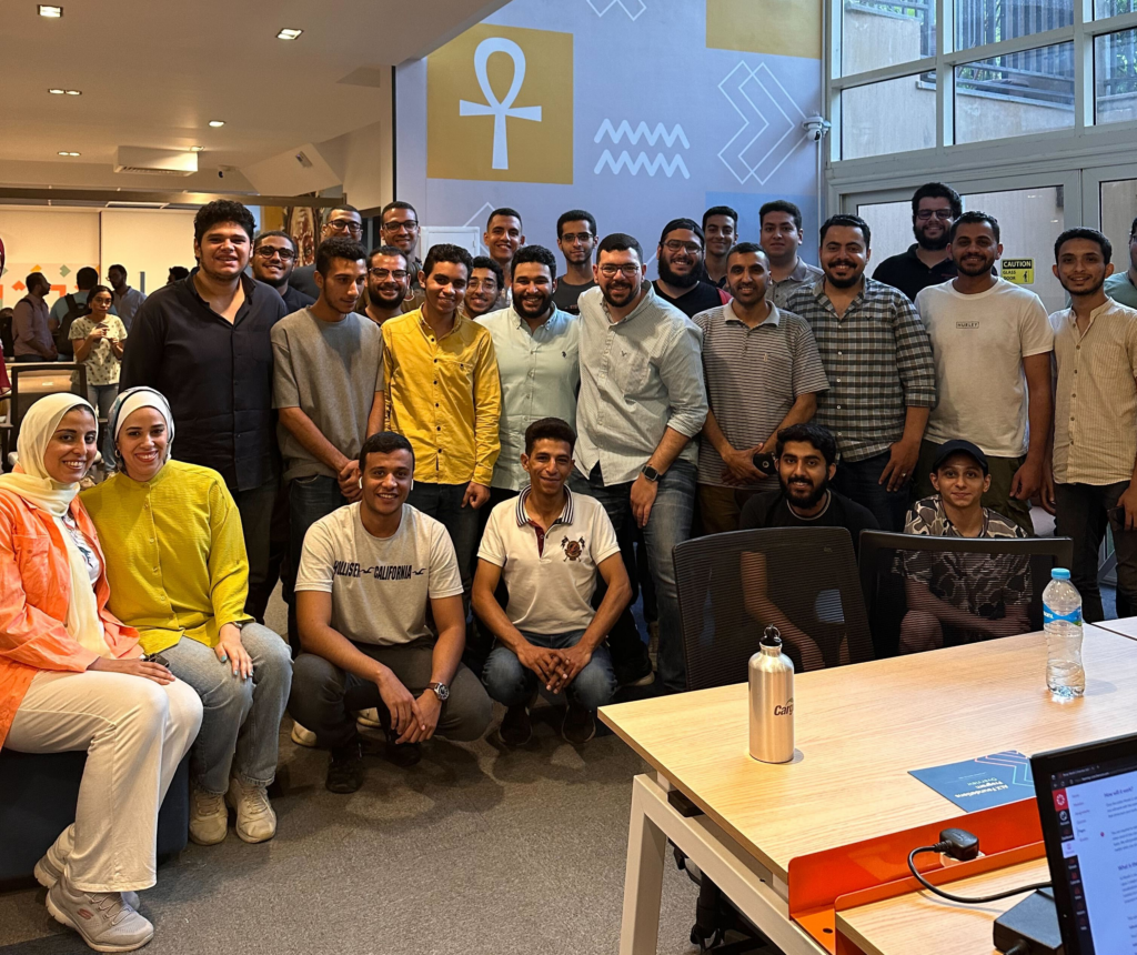 Data Science guru Mohamed Essam posing with ALX learners and team at the Maadi Tech Lab in Cairo